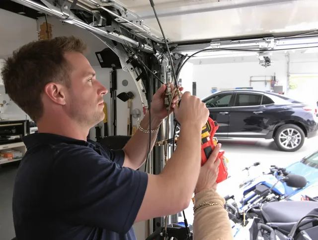 Eastlake Garage Door Repair safety certified technician performing cable replacement in Eastlake